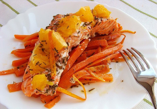 Trout with oranges on a carrot cushion