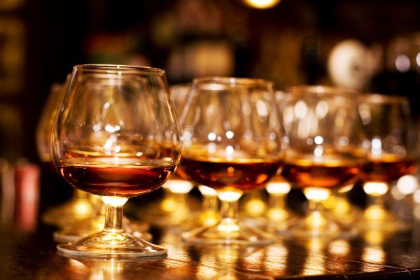 What distinguishes cognac and brandy